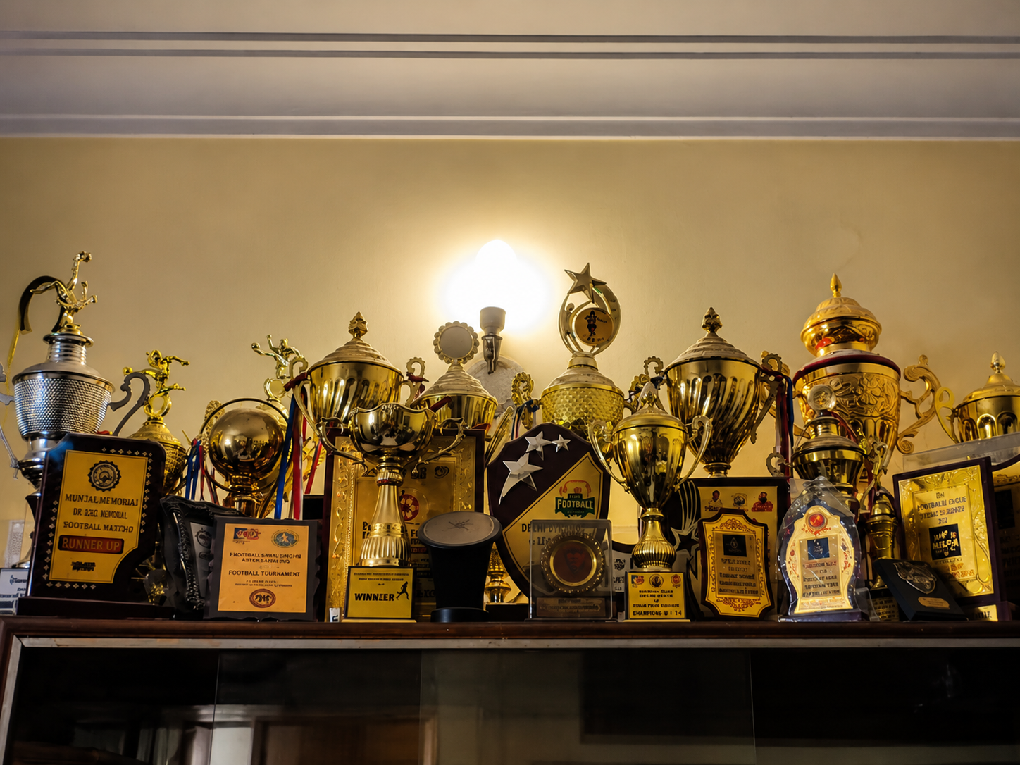 Championship trophies, cups and honors won across regional tournaments
